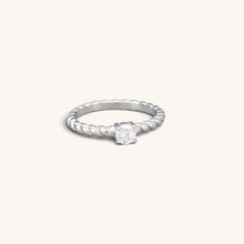 Silver tone stainless steel twisted solitaire ring with a round clear CZ stone